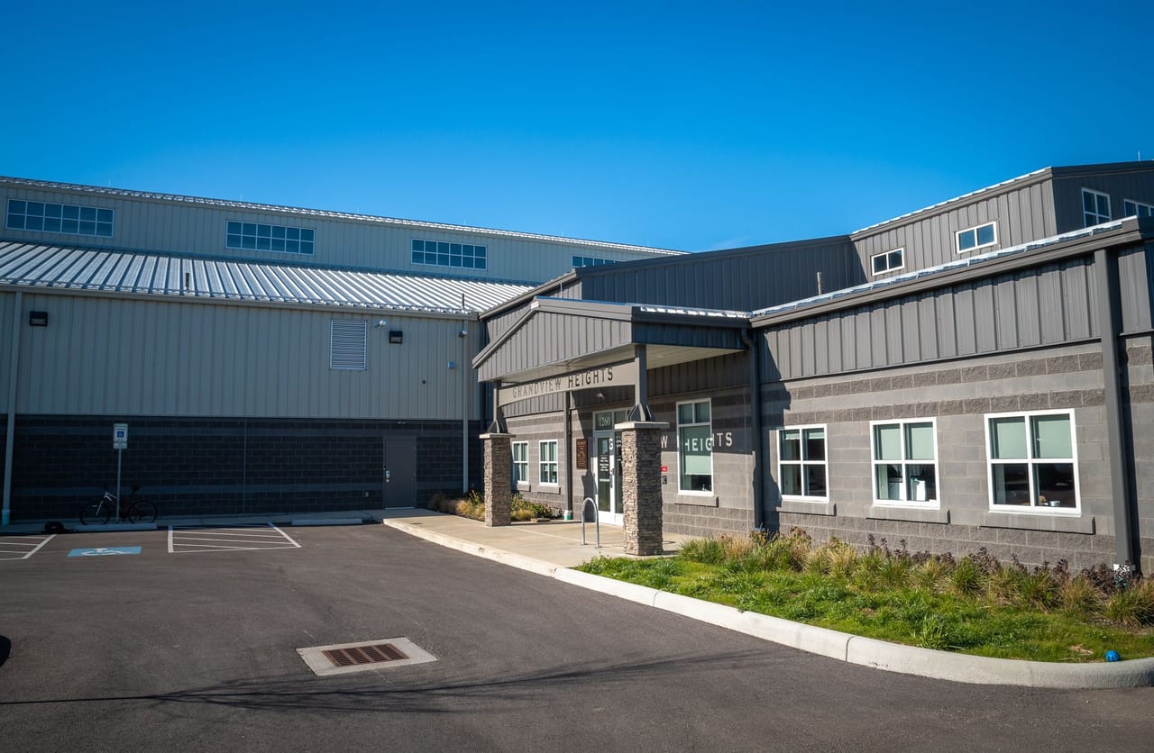 Grandview building exterior with an aluminum entrance under a canopy and rows of aluminum windows